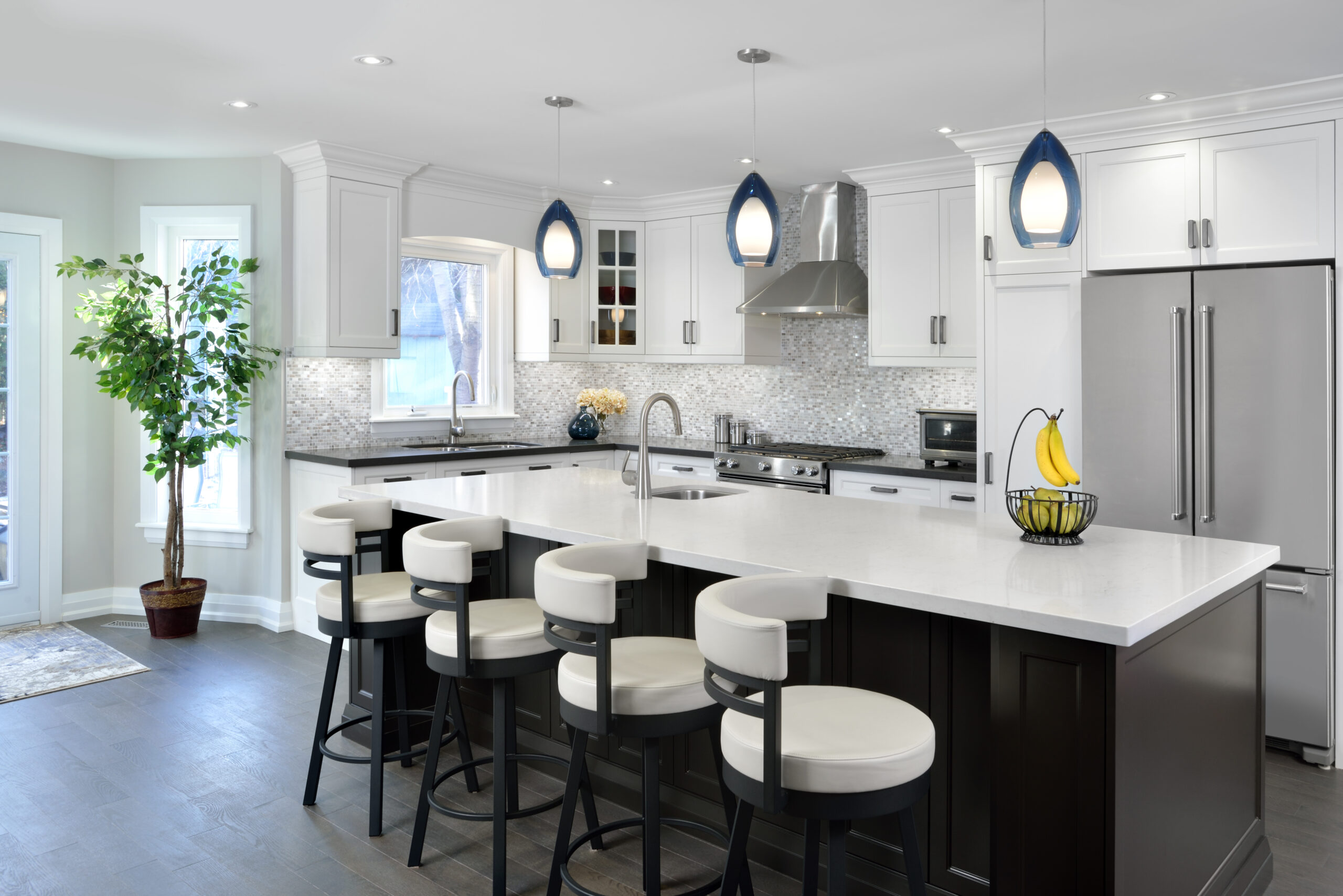 stone fireplace, black and withe kitchen, staircase