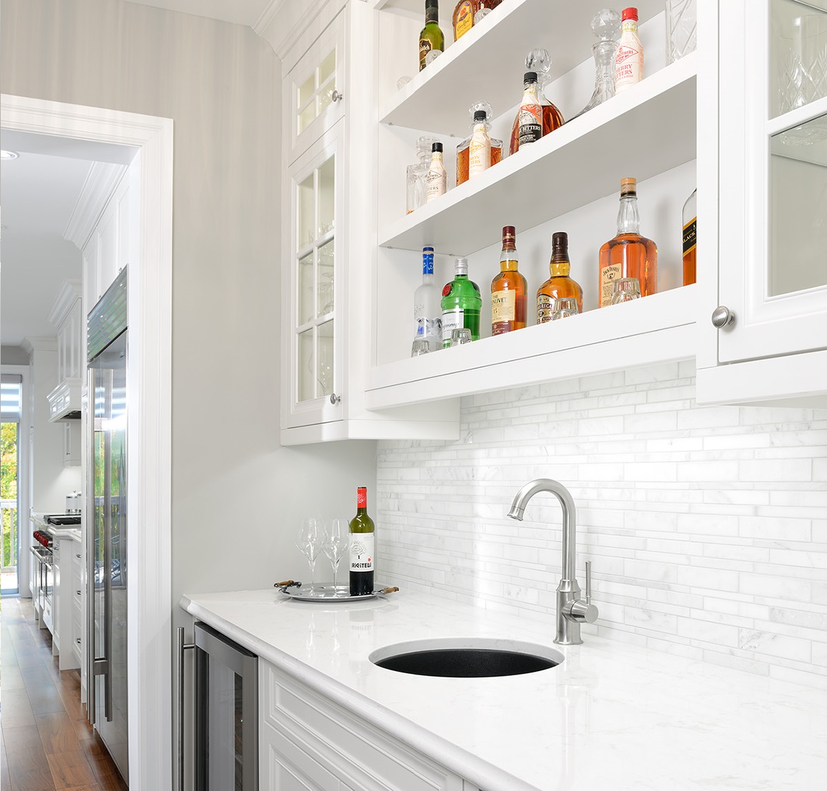 walnut floors, cambria, wolf, subzero, laundry, bar, stone wall