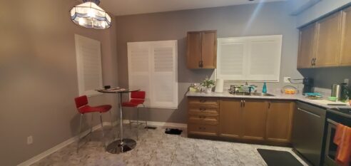 kitchen reno, bathroom reno, powder room, brizo, mitzi, waterfall, custom kitchen, ikea kitchen, two tone kitchen, kitchen pendants, brass hardware, artisan backsplash, caesarstone, kohler, tile floor, custom hood